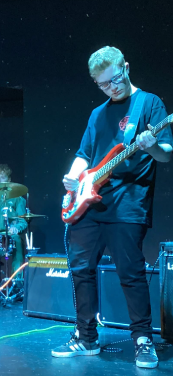 Red Central bass player